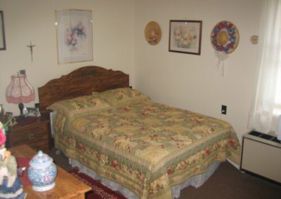An inside image of the bedroom with bed of garden style apartment at 211 LIBERTY STREET CARMICHAELS, PA 15320