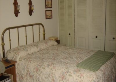 An image of a bed inside the charleston apartments