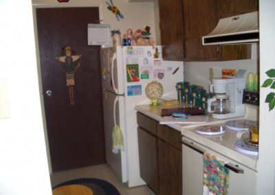 An image of a well furnished kitchen in grayson court apartments